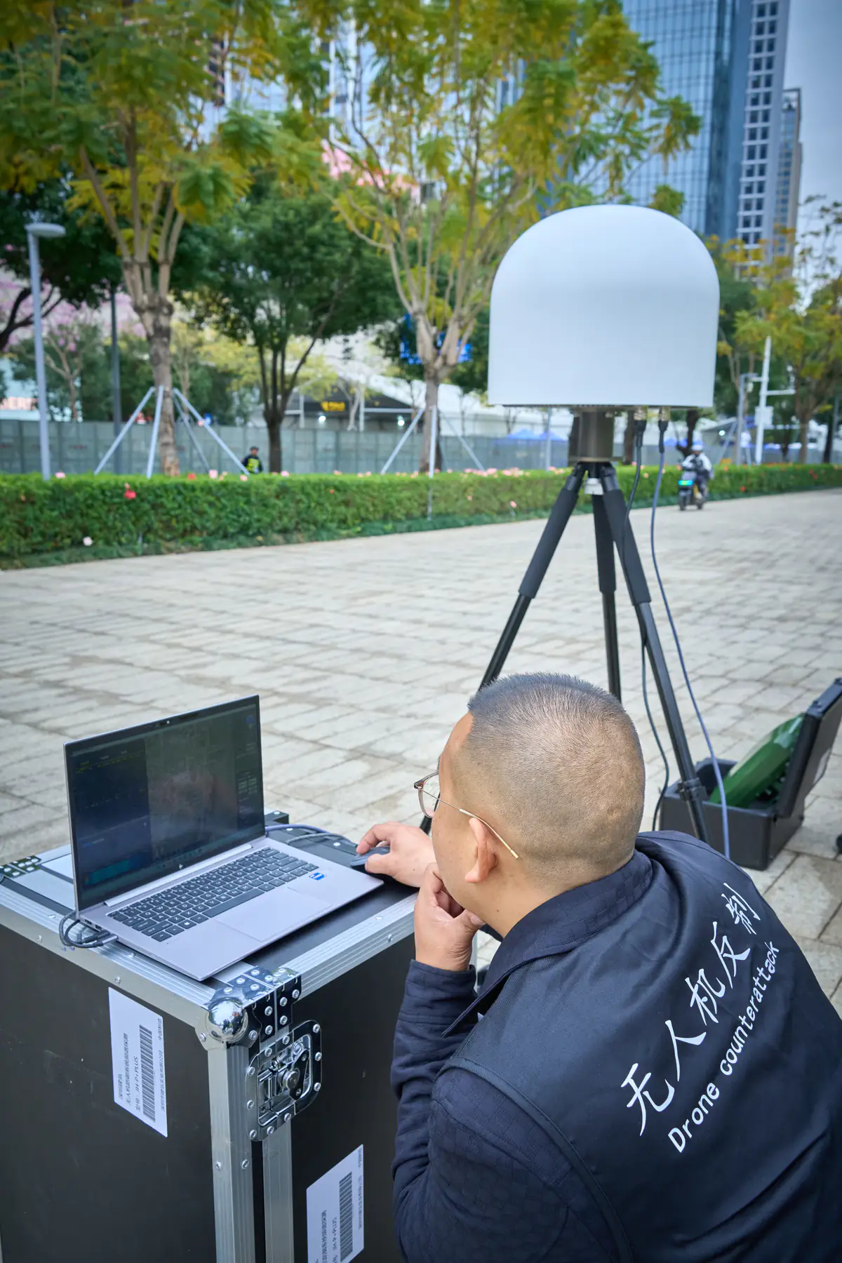 Operator verifying a counter-drone sensor interface on site